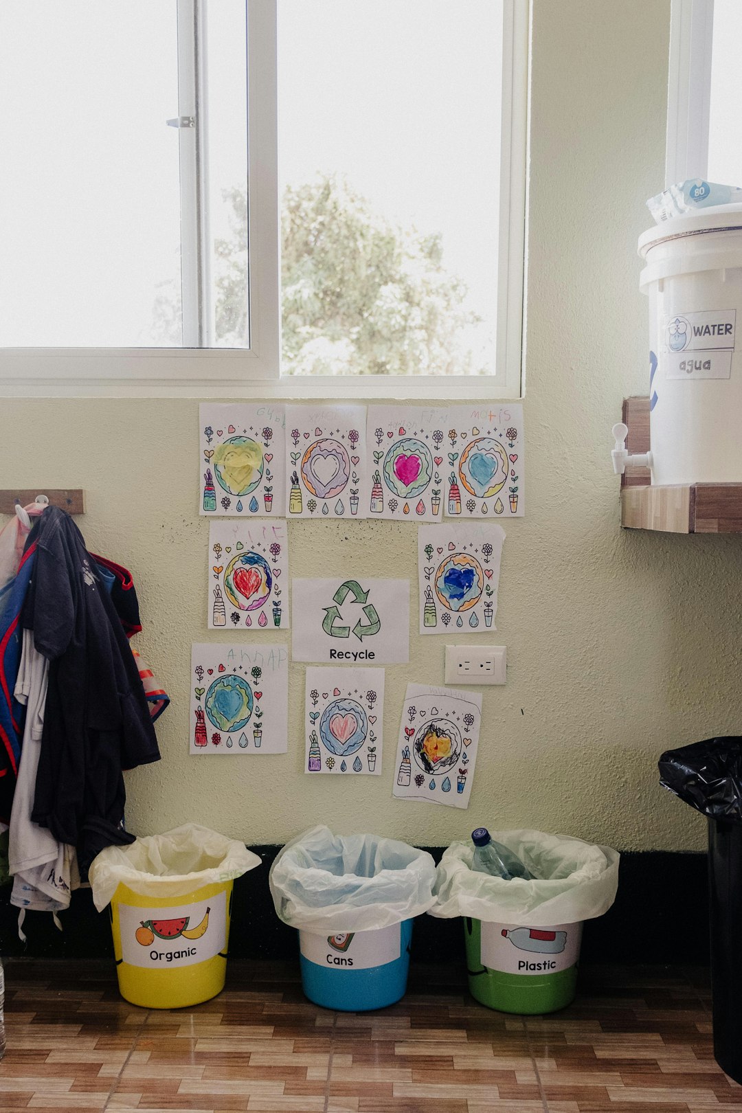 services-06 a-room-with-several-buckets-and-clothes-hanging-on-the-wall-xz9phzdq3ym